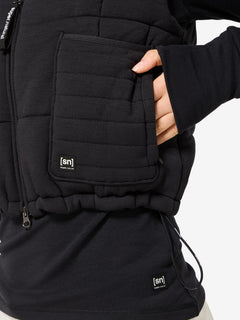 Naisten Puffy DWR Vest merinovillainen toppatakki, väri Jet Black – mallin päällä